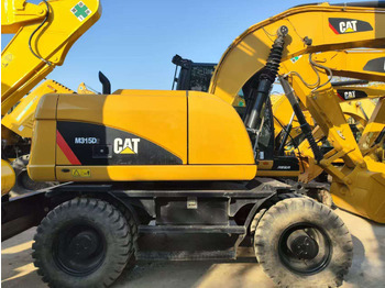 Riteņu ekskavators CATERPILLAR 315D