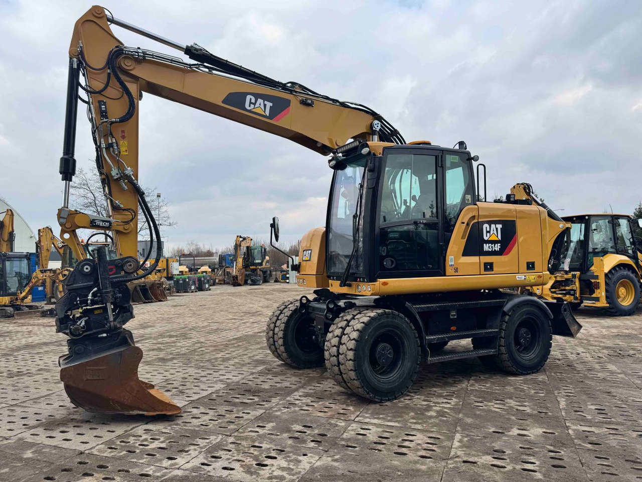 Riteņu ekskavators CAT M314F: foto 14